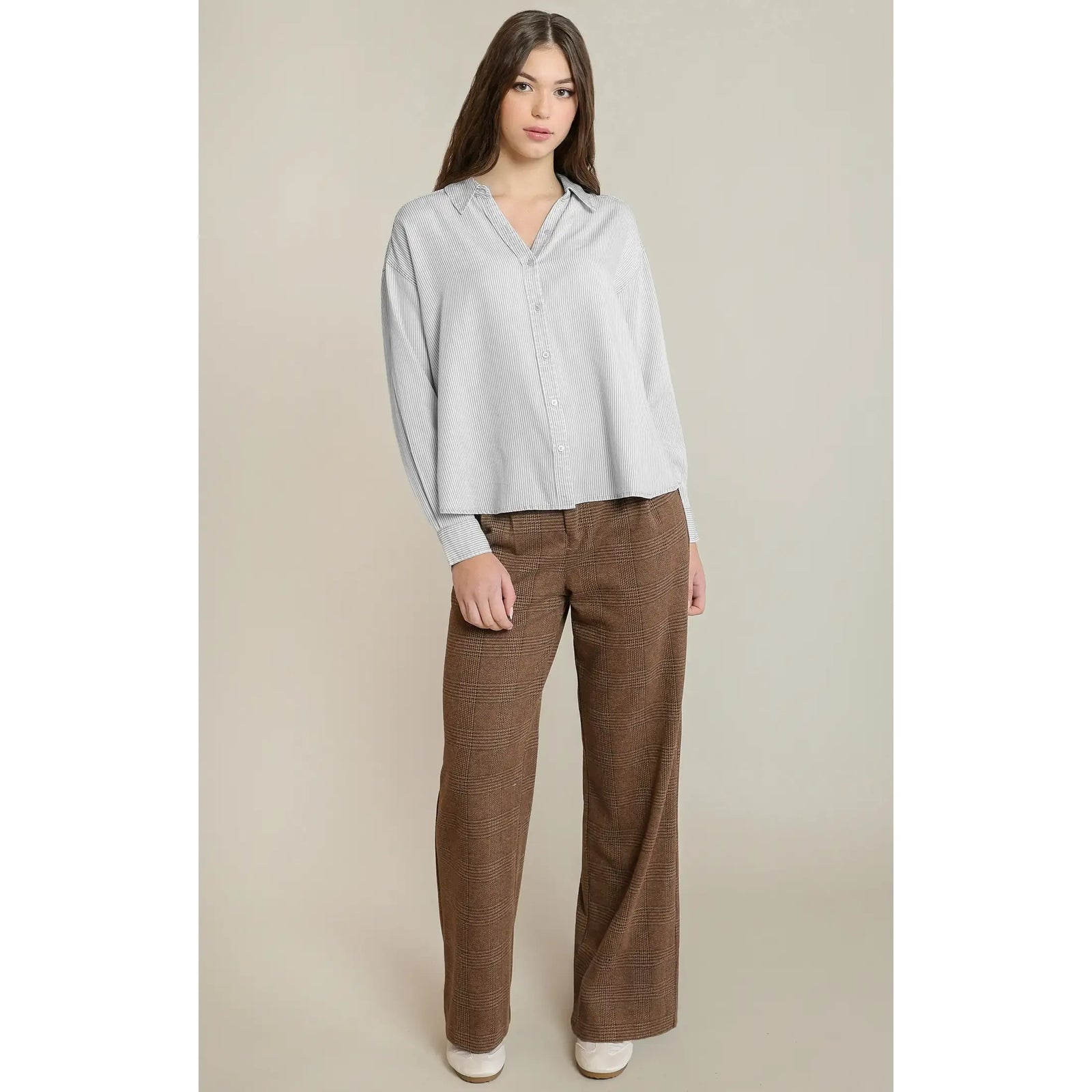 Relaxed button-front shirt with subtle white stripe detailing, featuring a comfortable fit and long sleeves for casual fall layering.