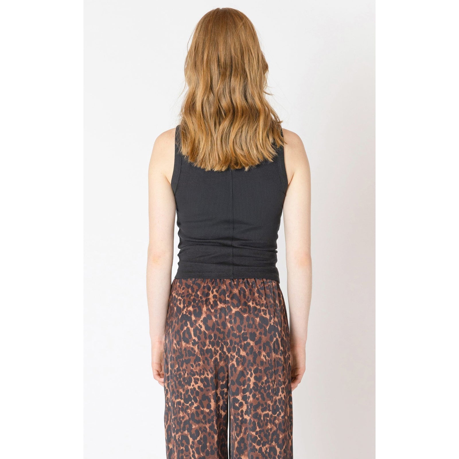 Stylish back view of the Dex Ribbed Tank Top in black, featuring soft ribbed fabric and classic crew neckline.