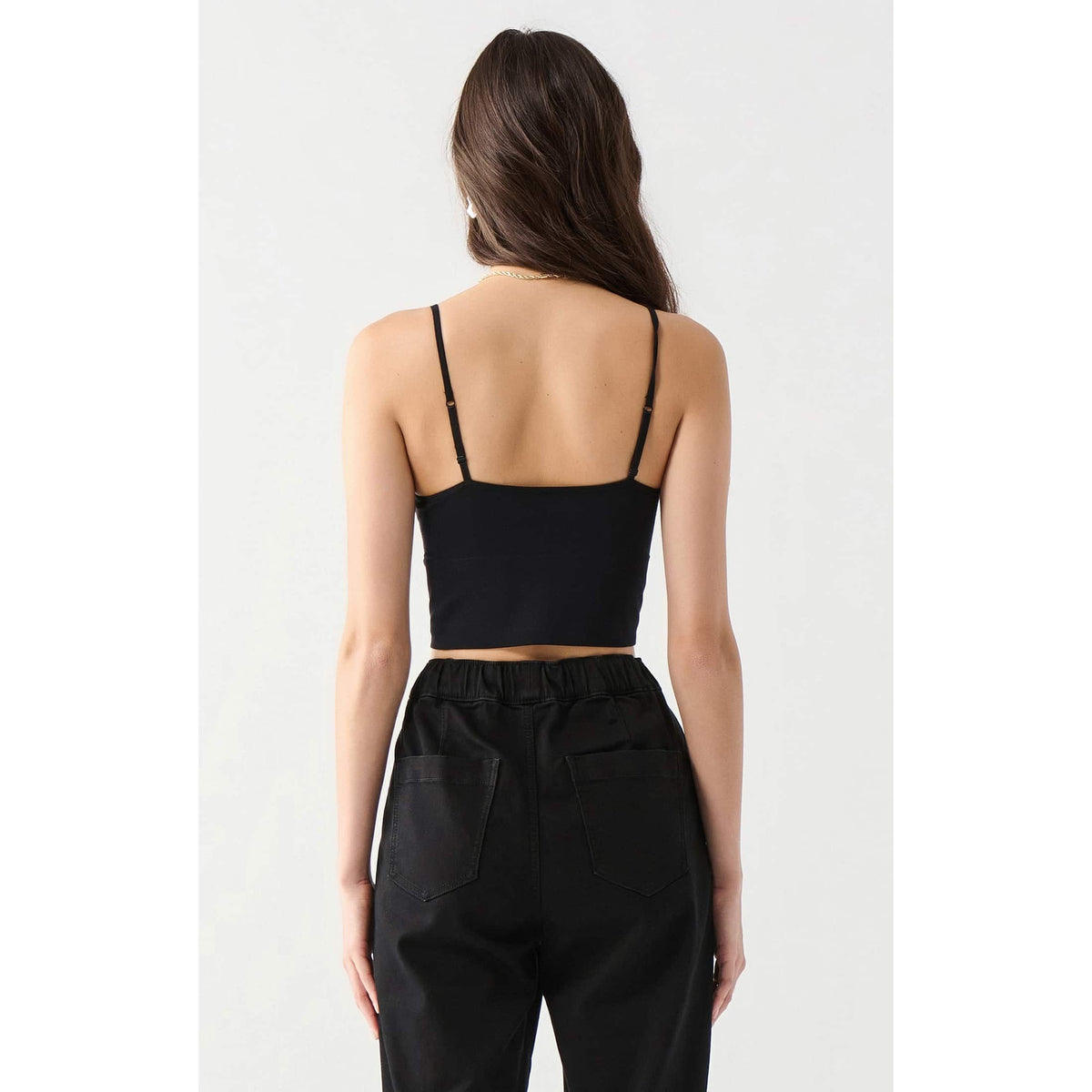 Dex Seamless Bra Top in black, back view with adjustable straps, cropped length, cotton-spandex blend.