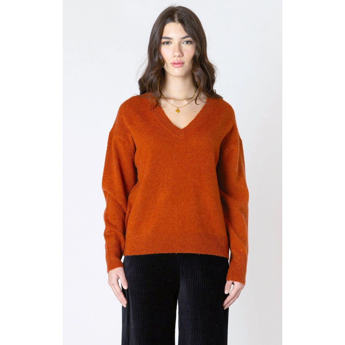 Cozy up in the burnt orange Dex Soft Touch Sweater, featuring a stylish V-neck and long sleeves for autumn.