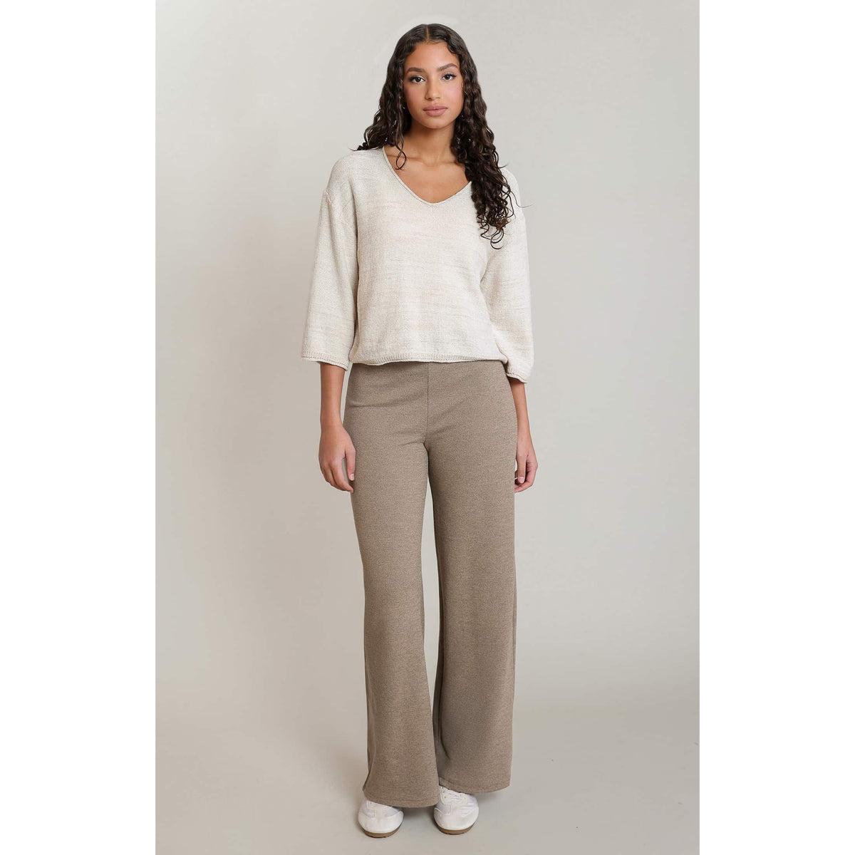 Cream Dex V-Neck 3/4 Sleeve Knit Top with cropped silhouette on a model.