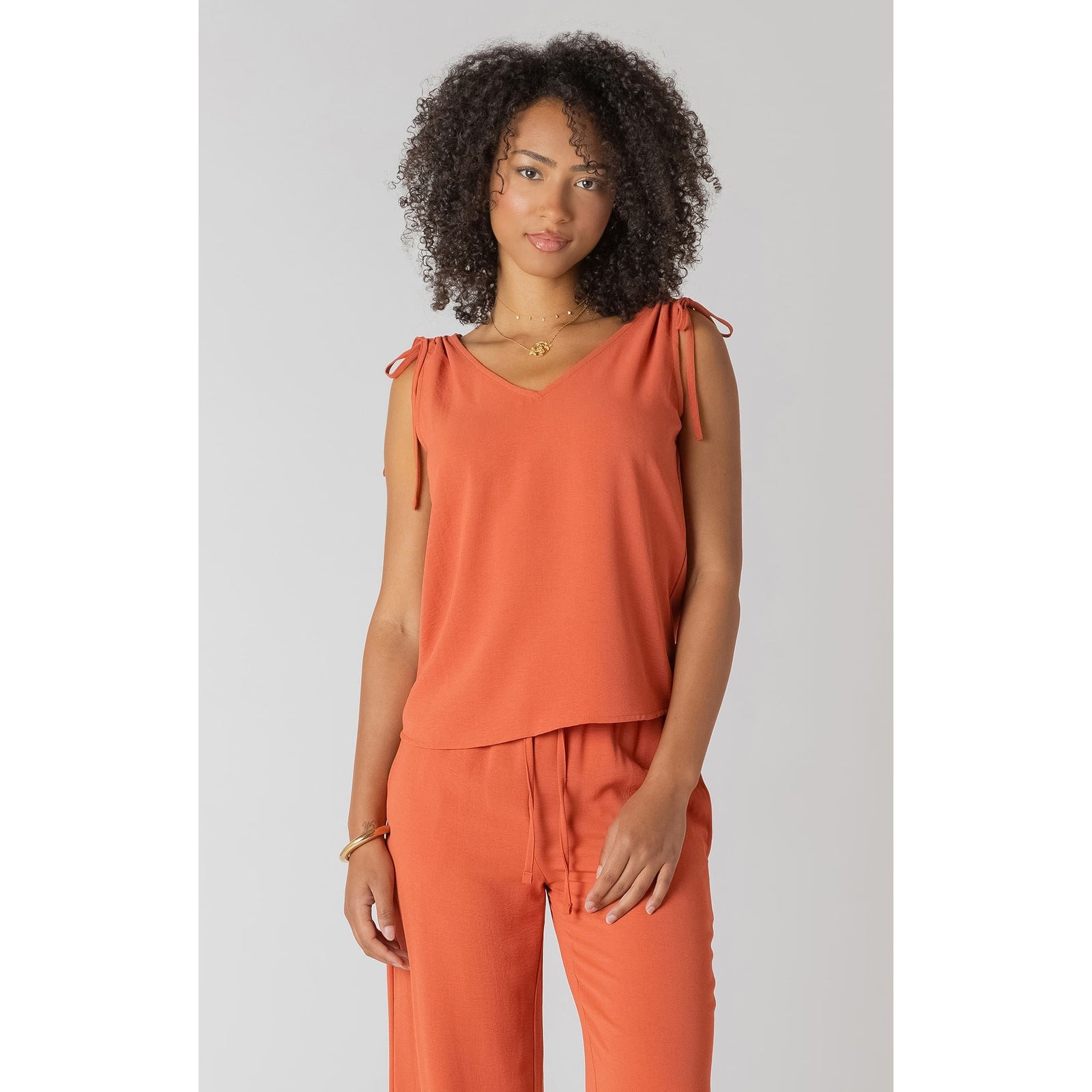 Room 34 V-Neck Top with Shoulder Ties in terracotta, sleeveless with adjustable shoulder ties and relaxed fit.