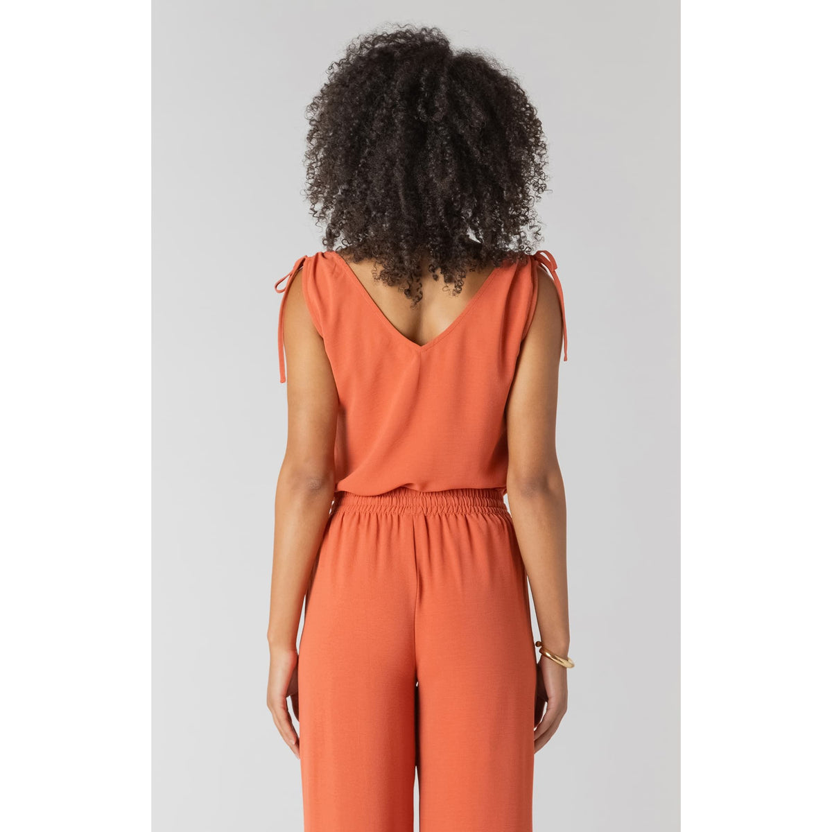 Room 34 V-Neck Top with Shoulder Ties in coral, sleeveless with adjustable shoulder ties and a relaxed fit.