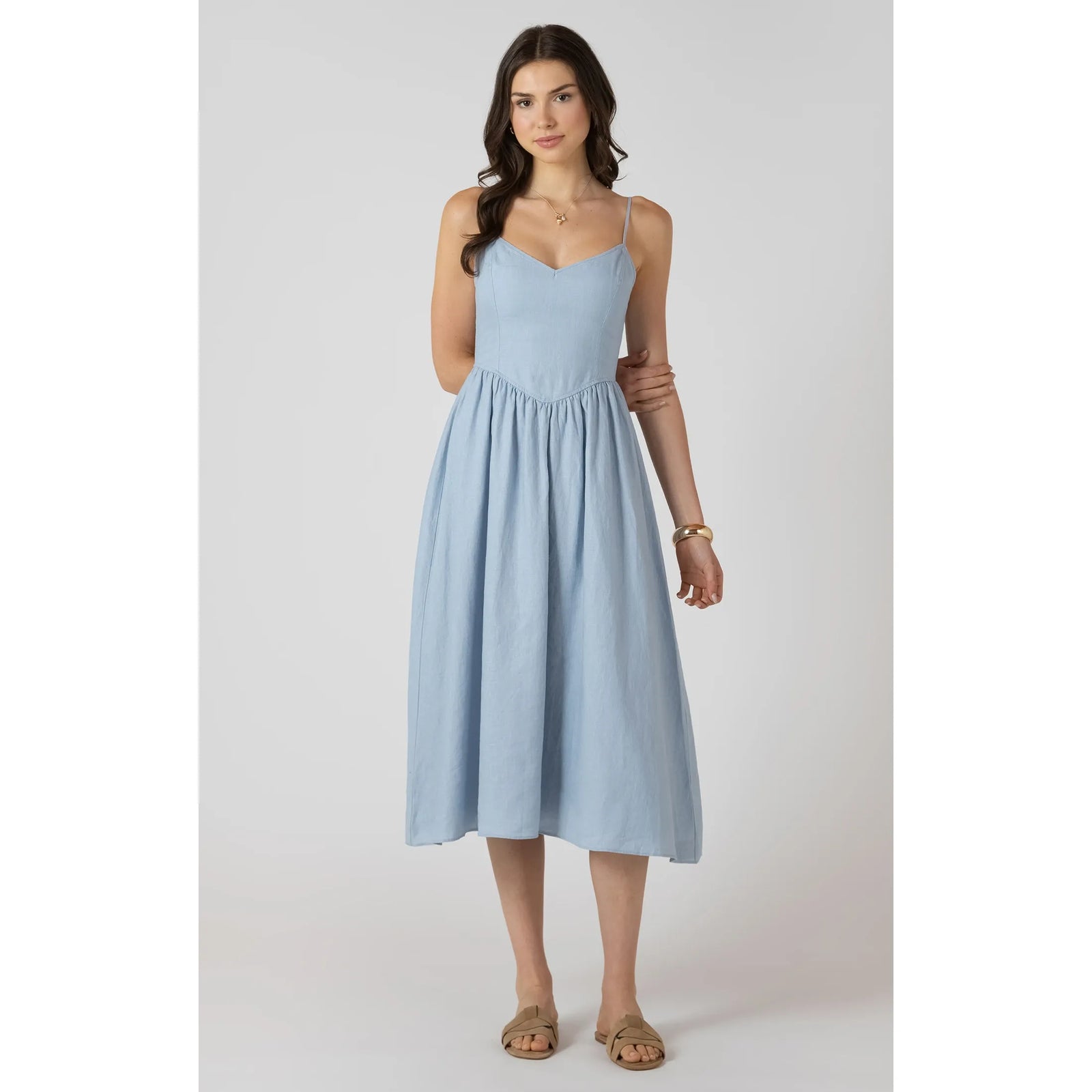 Dex V Waist Maxi Dress in light blue with a V-waist, thin straps, and a flowing floor-length skirt.