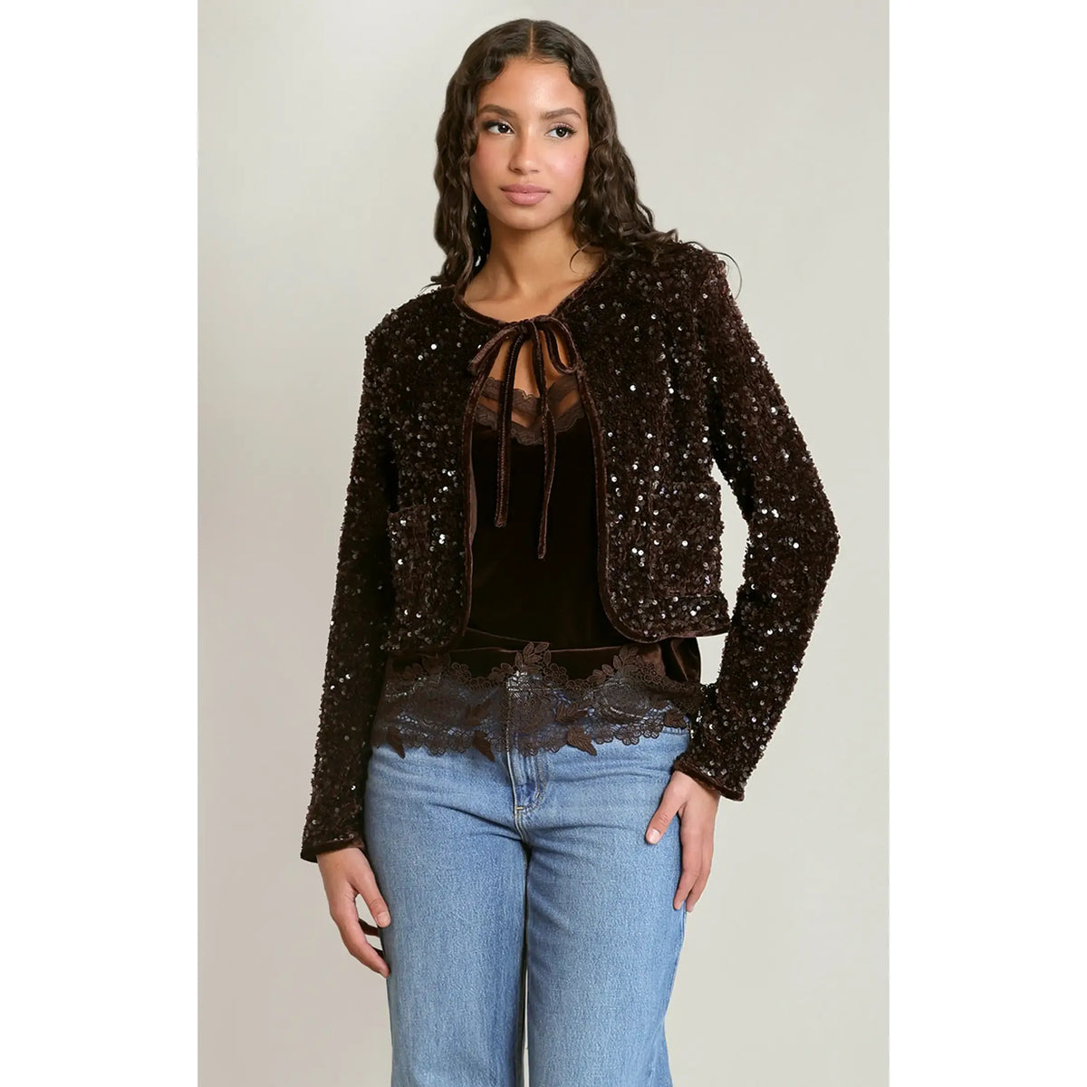 Chocolate velvet sequin cropped jacket with tie neck, featuring a dazzling light-catching overlay and plush texture.
