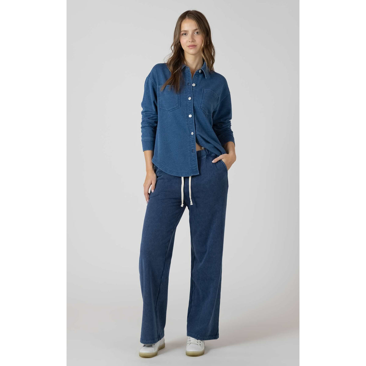 Dex Washed Knit Shirt in soft-washed indigo with two front pockets and a button-front, worn by a model.