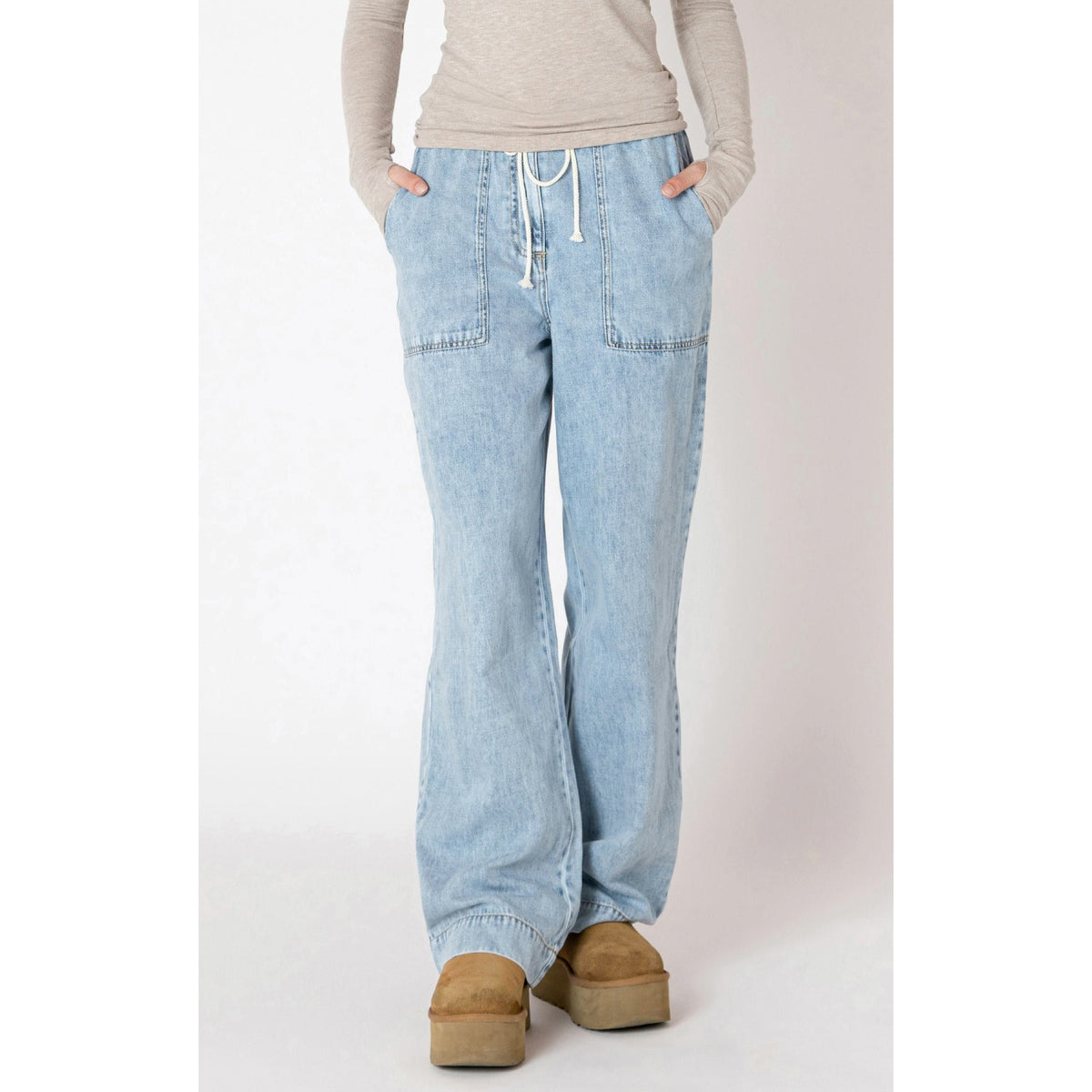 Dex Wide Leg Denim Pants in washed blue, featuring a drawstring waist and spacious pockets for summer adventures.