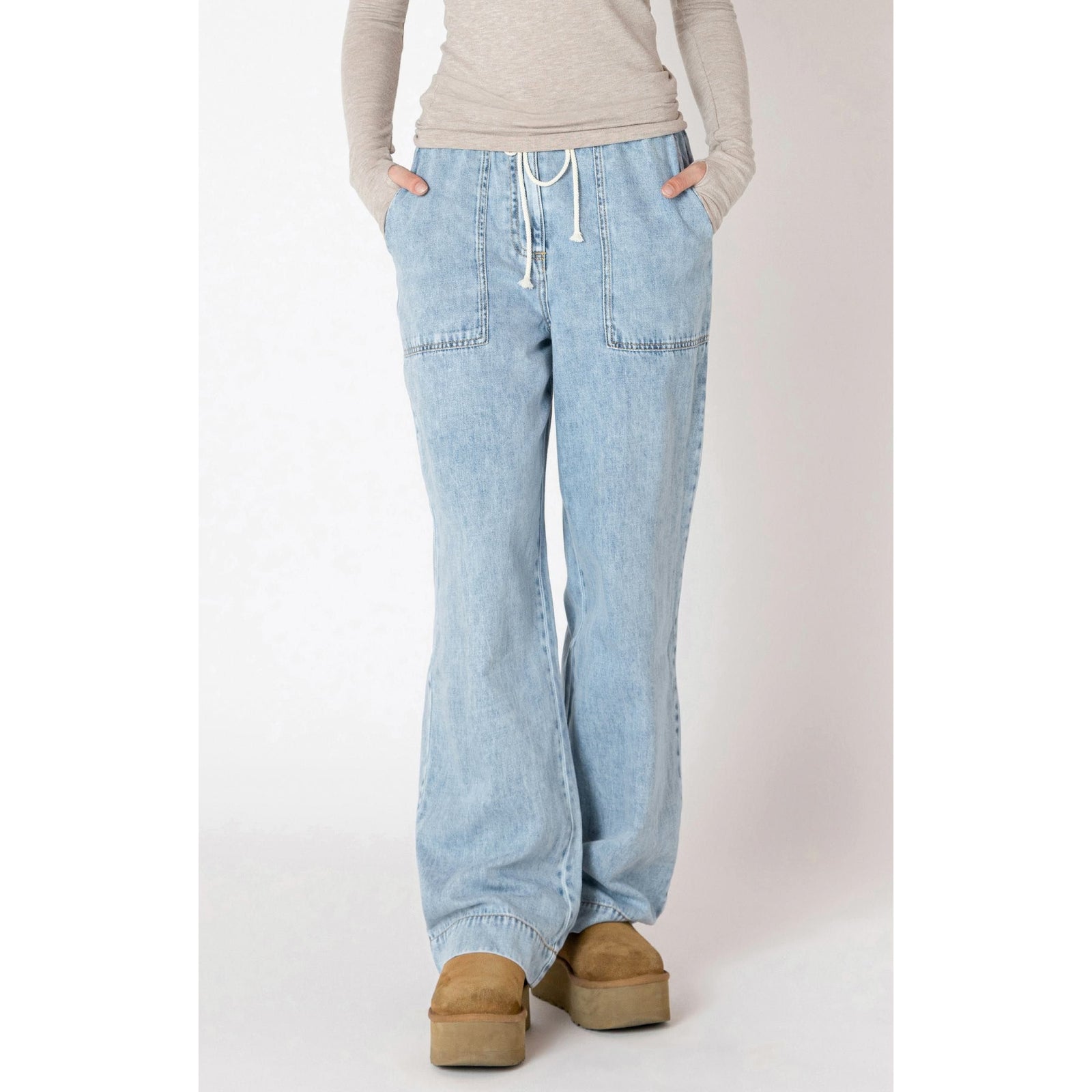 Dex Wide Leg Denim Pants in washed blue, featuring a drawstring waist and spacious pockets for summer adventures.