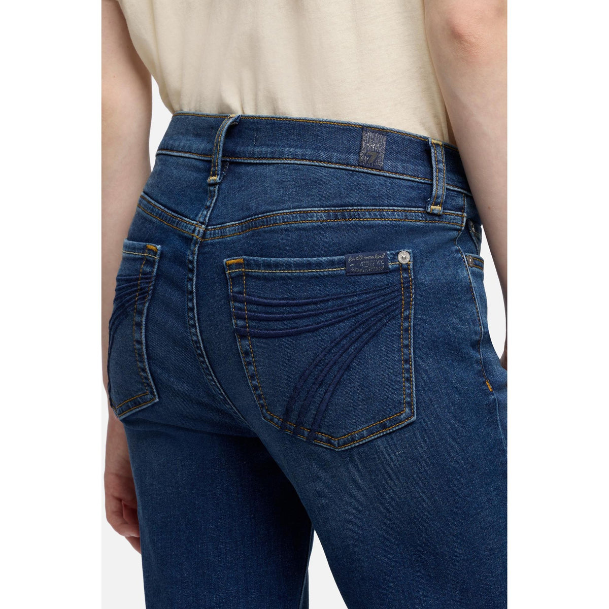 7 for all Mankind Dojo Melrose jeans, back view with curved seam accents on pocket and belt loops.