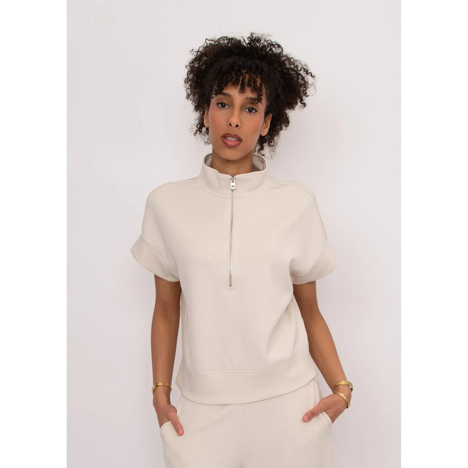 Dua Soft Knit 1/2 Zip Top in beige with short sleeves and relaxed fit.