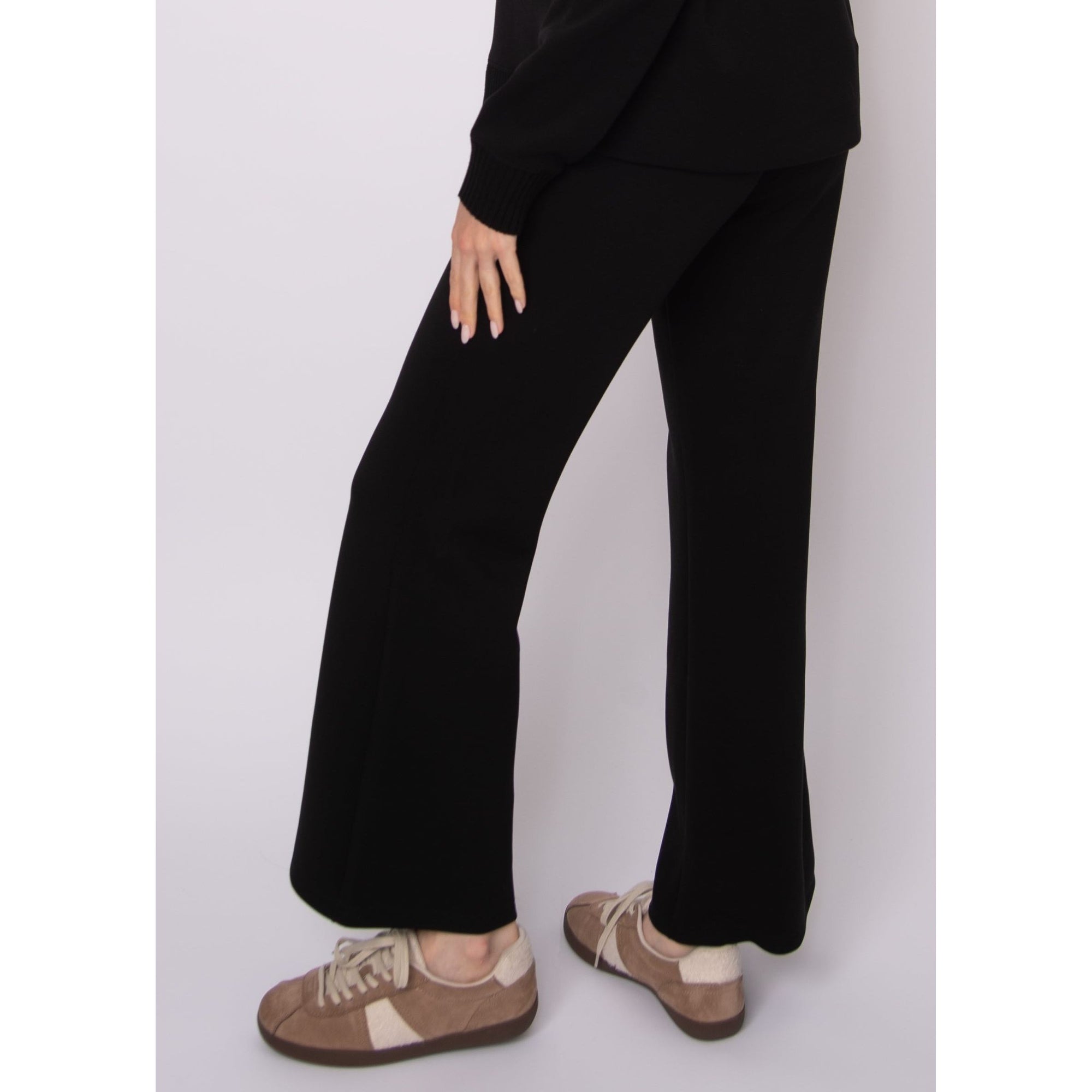 Florine Soft Knit Pull-On Flare Pants in black with a close-fitting leg and flared hem.