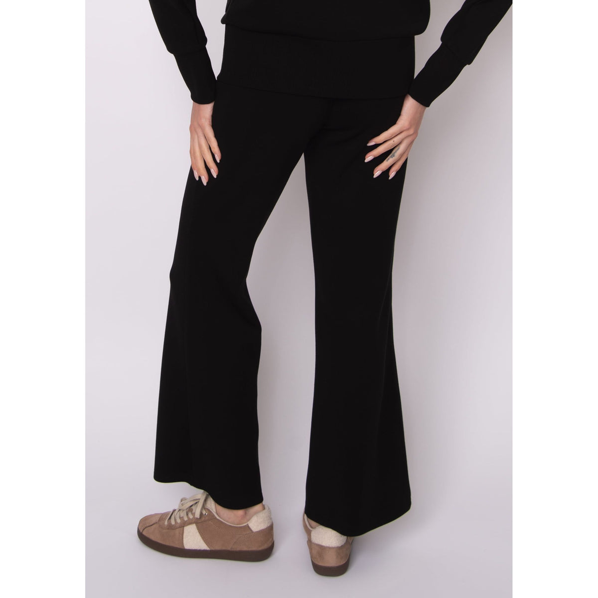 Florine Soft Knit Pull On Flare Pants in black with a slim, close-fitting leg that flares at the hem.