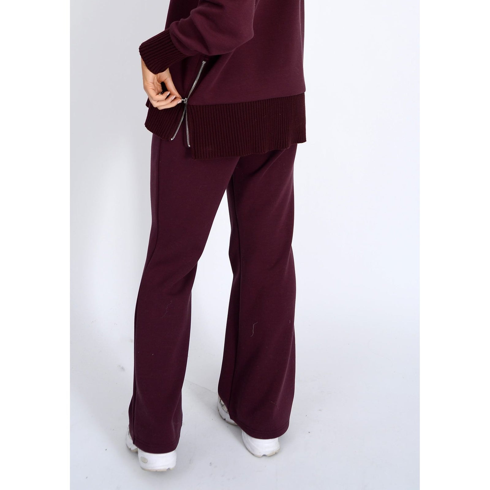Florine Soft Knit Pull On Flare Pants in prune; close-fitting legs transition to a flared hem