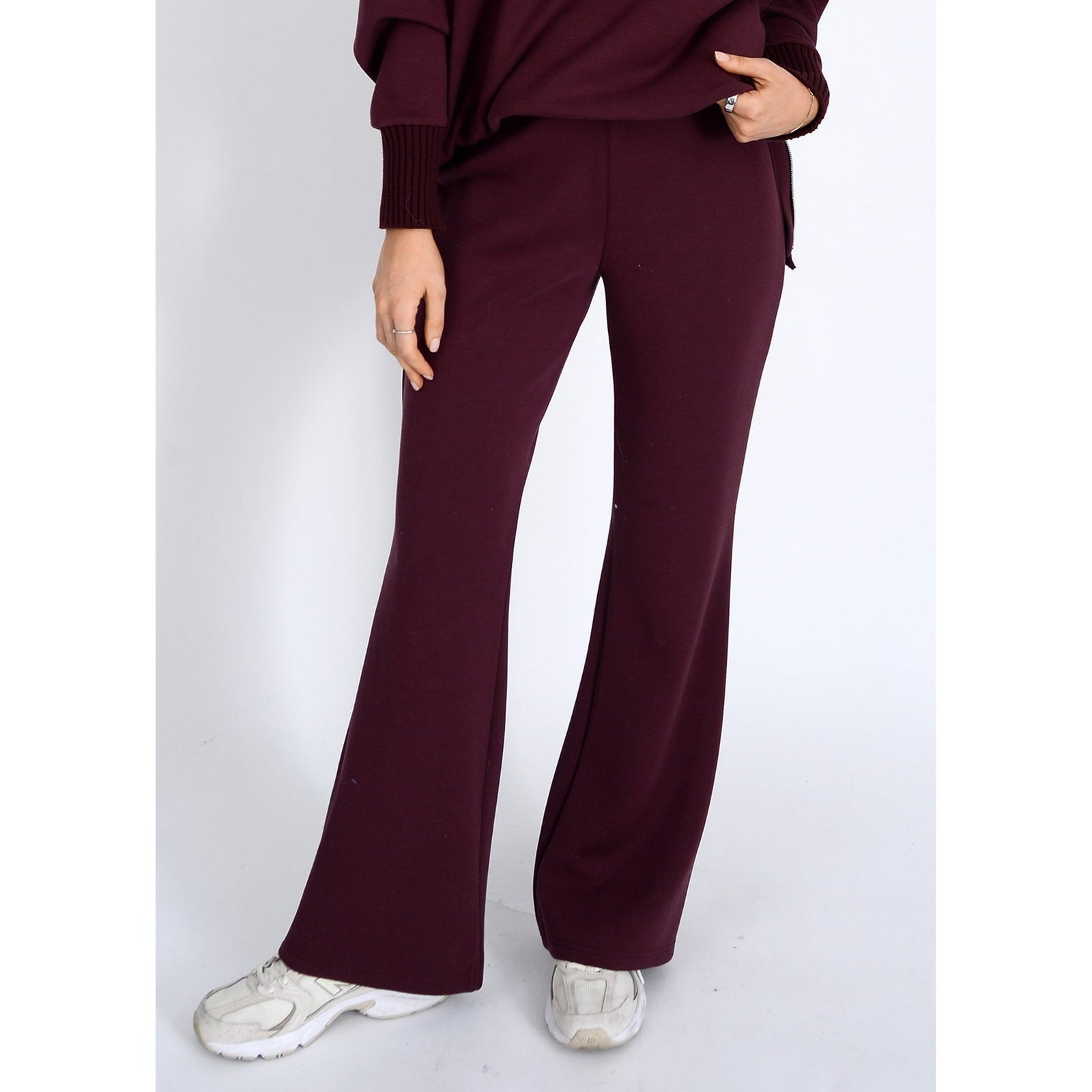 Prune Florine Soft Knit Pull-On Flare Pants on model with white sneakers