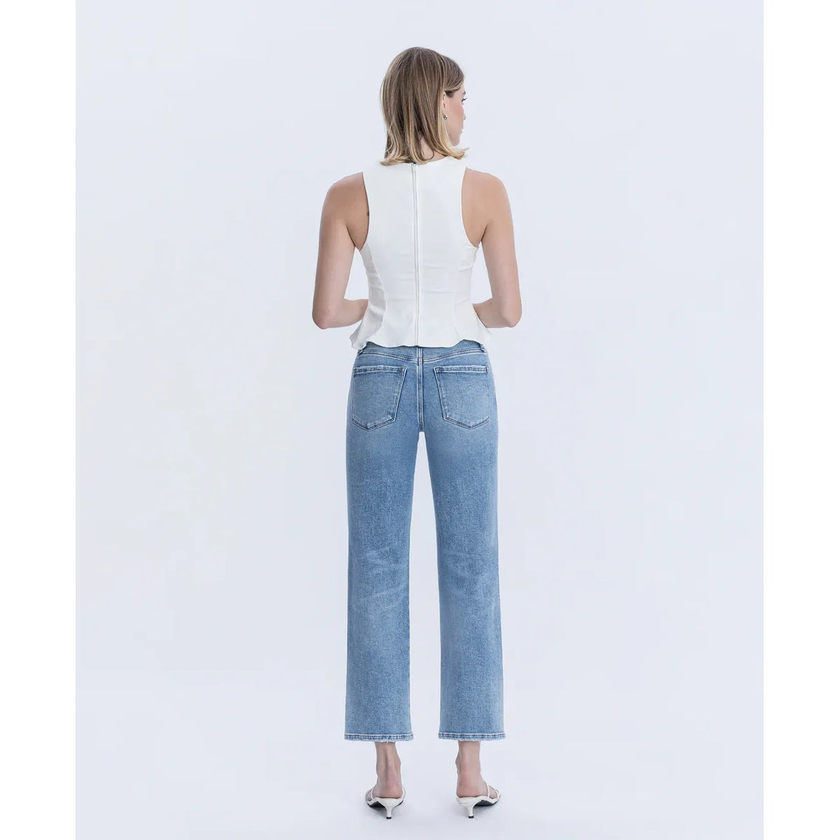 Flying Monkey Blissful Symphony high-rise ankle-straight jeans in stretch denim on a model wearing a white top.