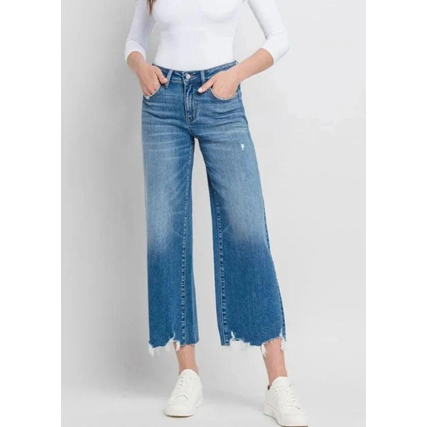 Elevate your look with Flying Monkey Delightful High Rise Crop Wide Leg Denim featuring a chic distressed hem.