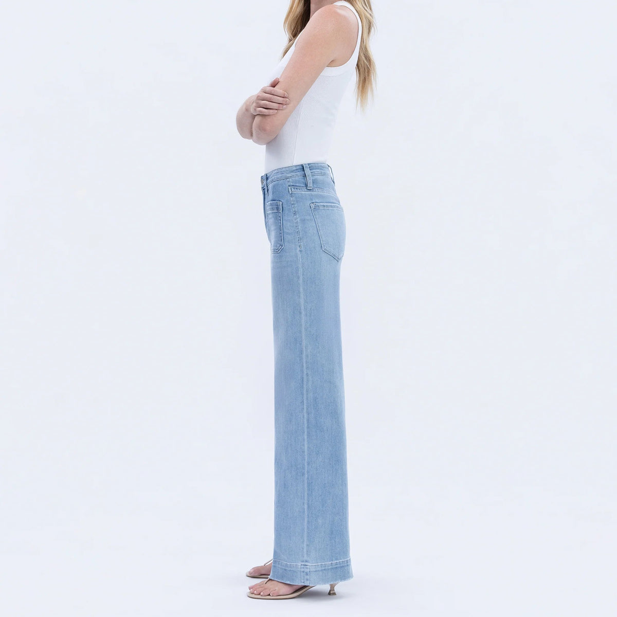 Flying Monkey Dignity high-rise patch-pocket wide-leg denim trousers in light wash worn by model