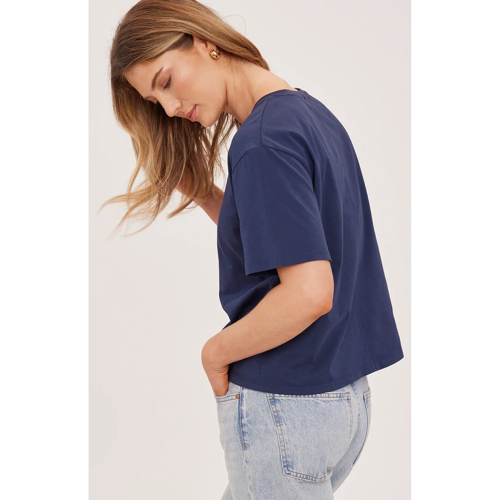 Gentle Fawn Brigitte Tshirt in navy cotton jersey with a relaxed crew neck worn by a model.