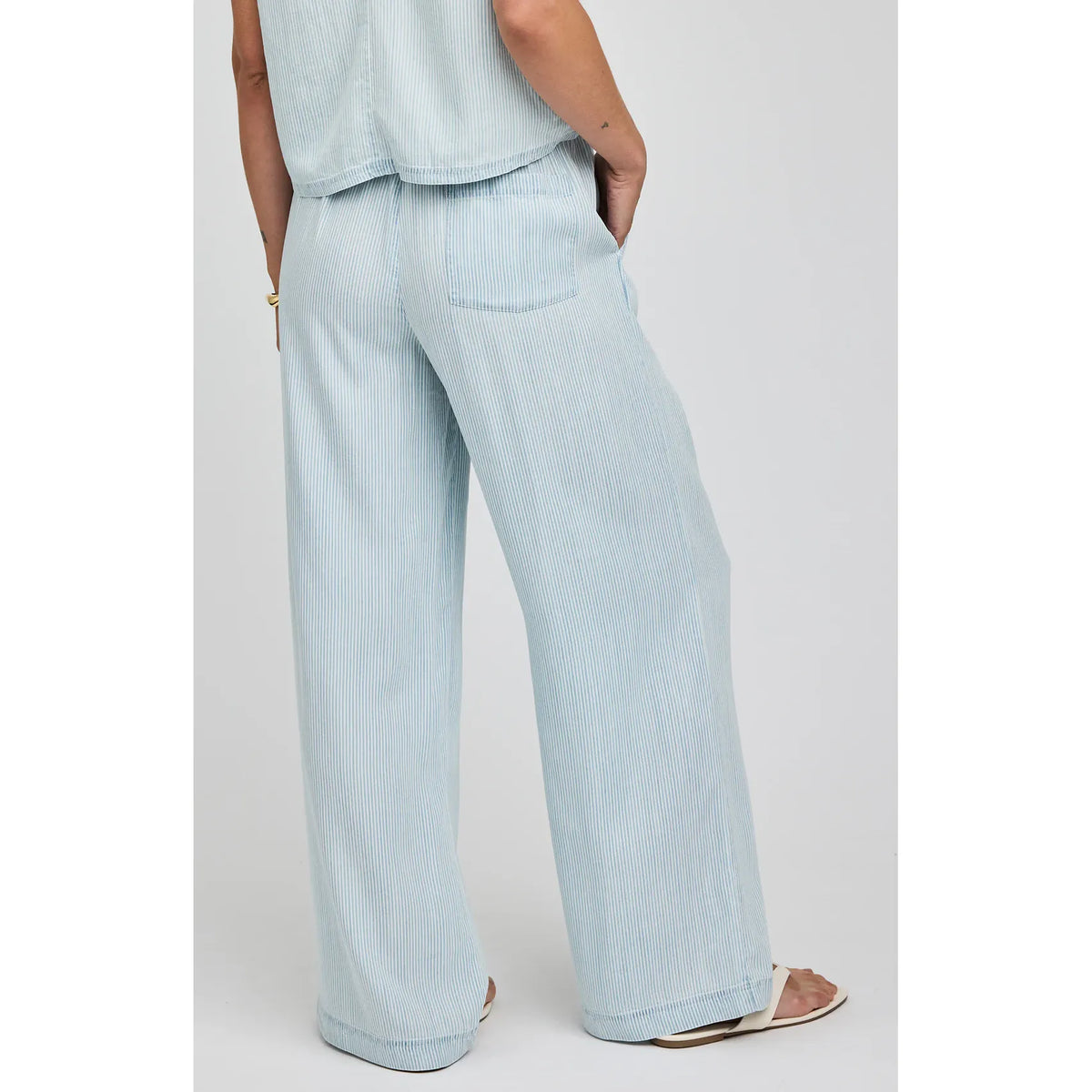 Gentle Fawn Camille Pant, 100% Tencel, light blue pinstripe, wide-leg, mid-rise, elastic drawcord waist, slash pockets.