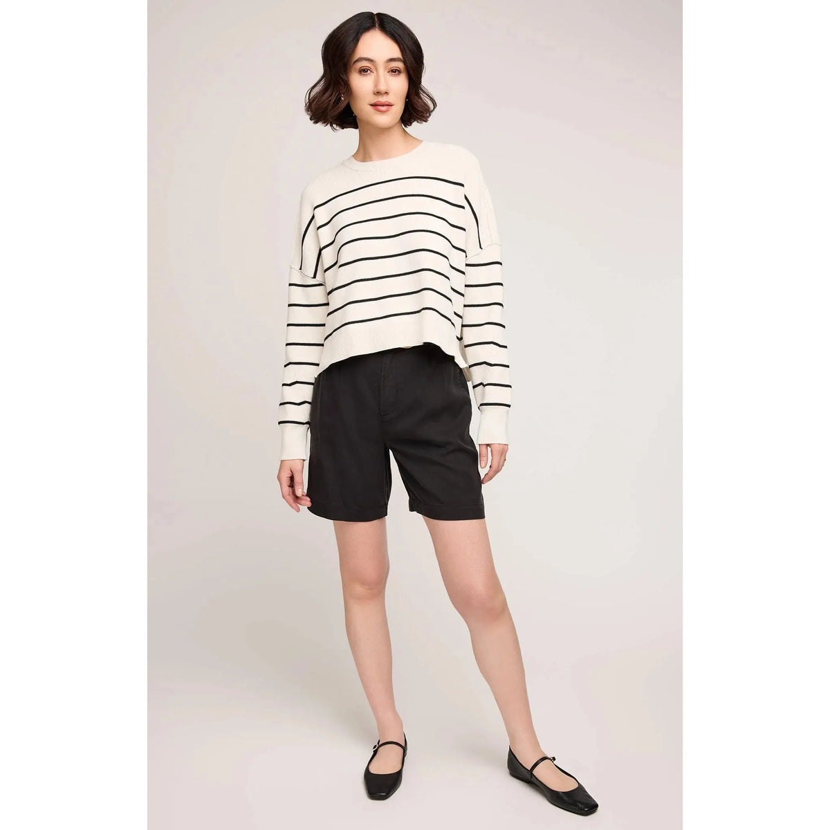 Gentle Fawn Echo Sweater in cream with black stripes, oversized knit with side slits and seam details.