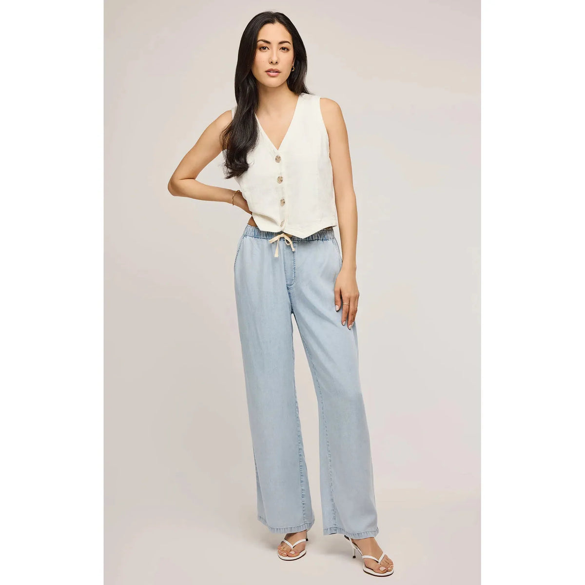 Stylish model wearing Gentle Fawn Elio Pant in light blue, featuring a relaxed fit and comfortable waistband.
