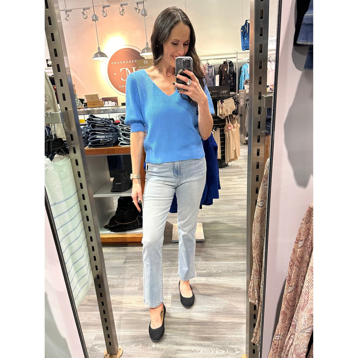Gentle Fawn Phoebe V-Neck Sweater worn by a shopper in-store, cobalt knit with puff sleeves.