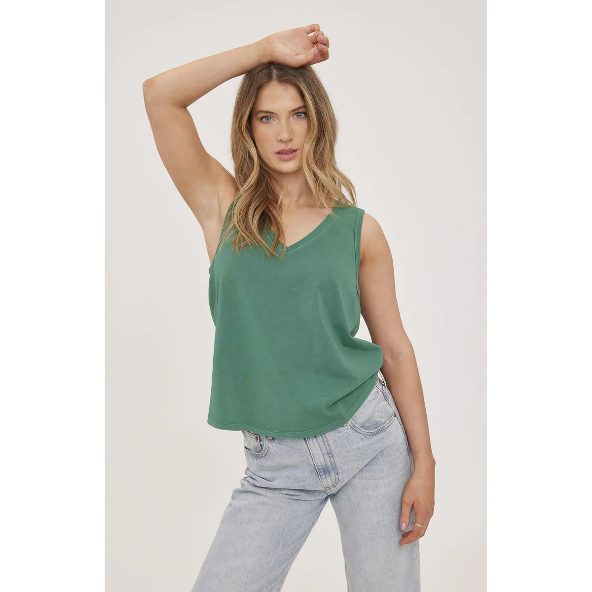Gentle Fawn Giselle Tank in green cotton jersey on model, V-neck, relaxed fit, paired with light wash jeans.