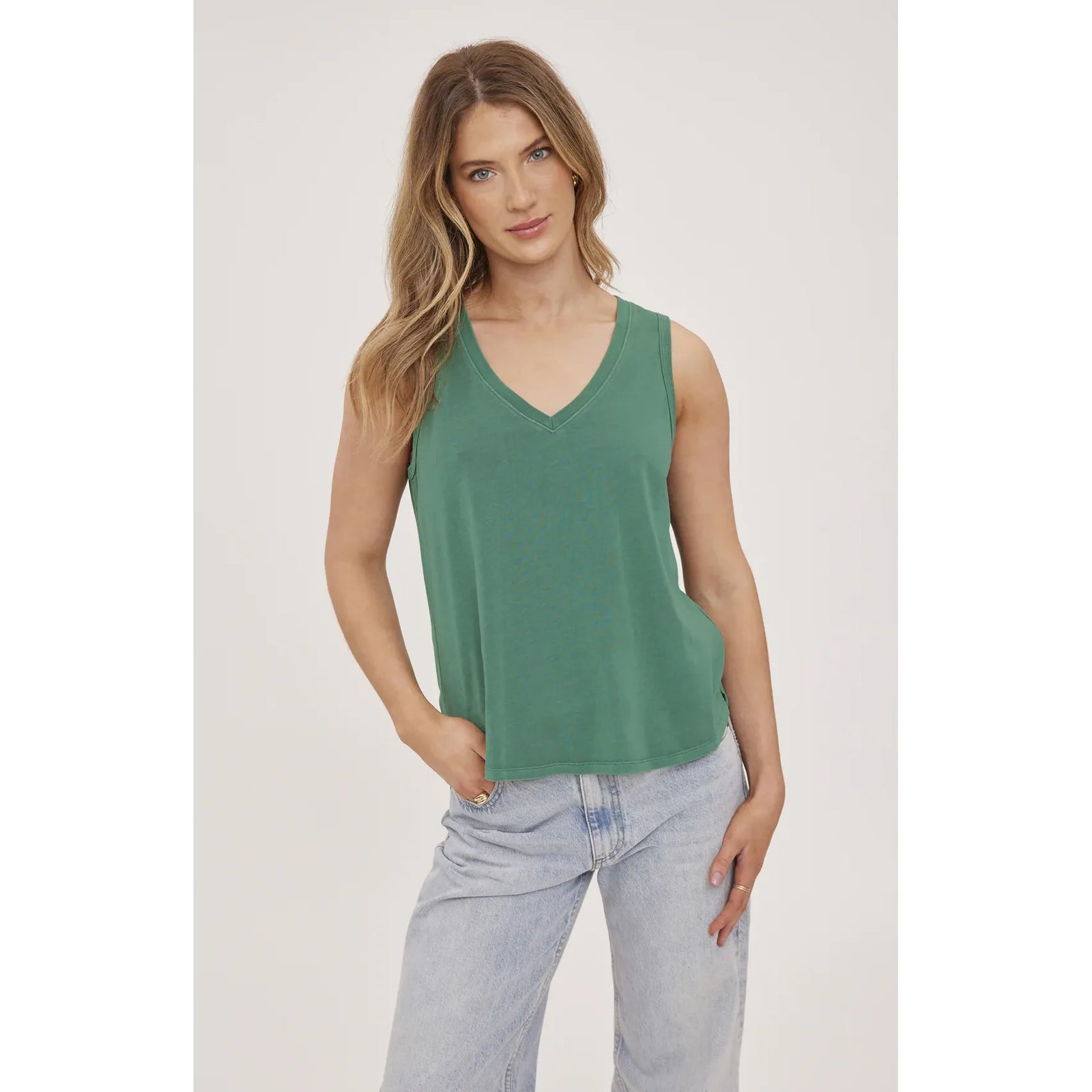 Gentle Fawn Giselle Tank in green cotton jersey on model with jeans, V-neck sleeveless top.