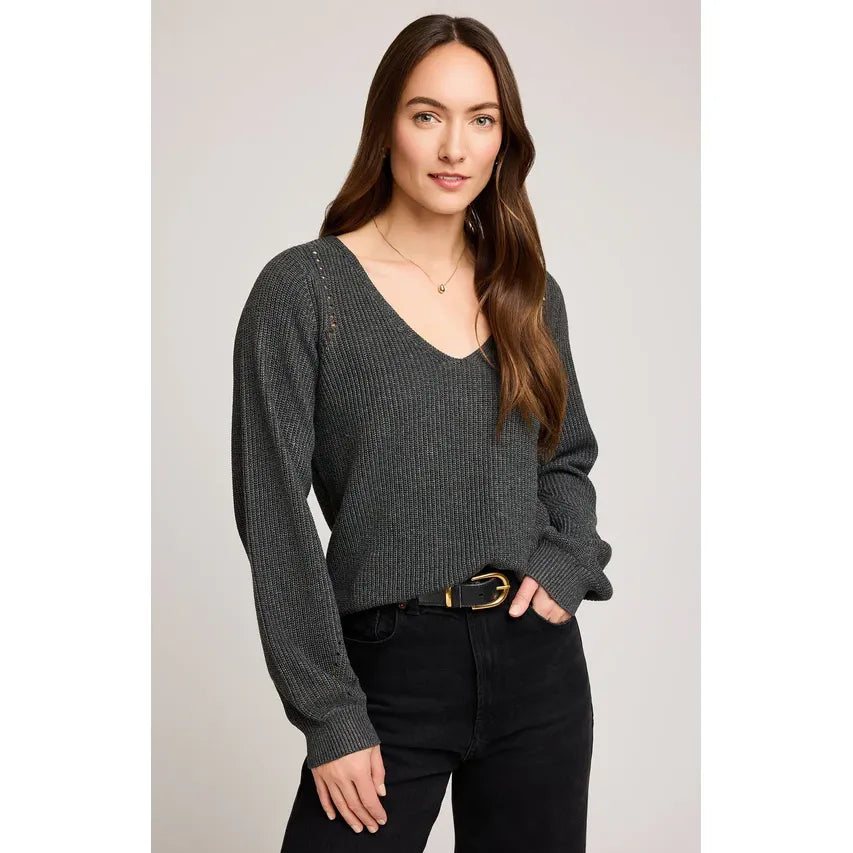 Model wearing Gentle Fawn Hailey Pullover Sweater in charcoal knit with V-neck and pointelle details on balloon sleeves