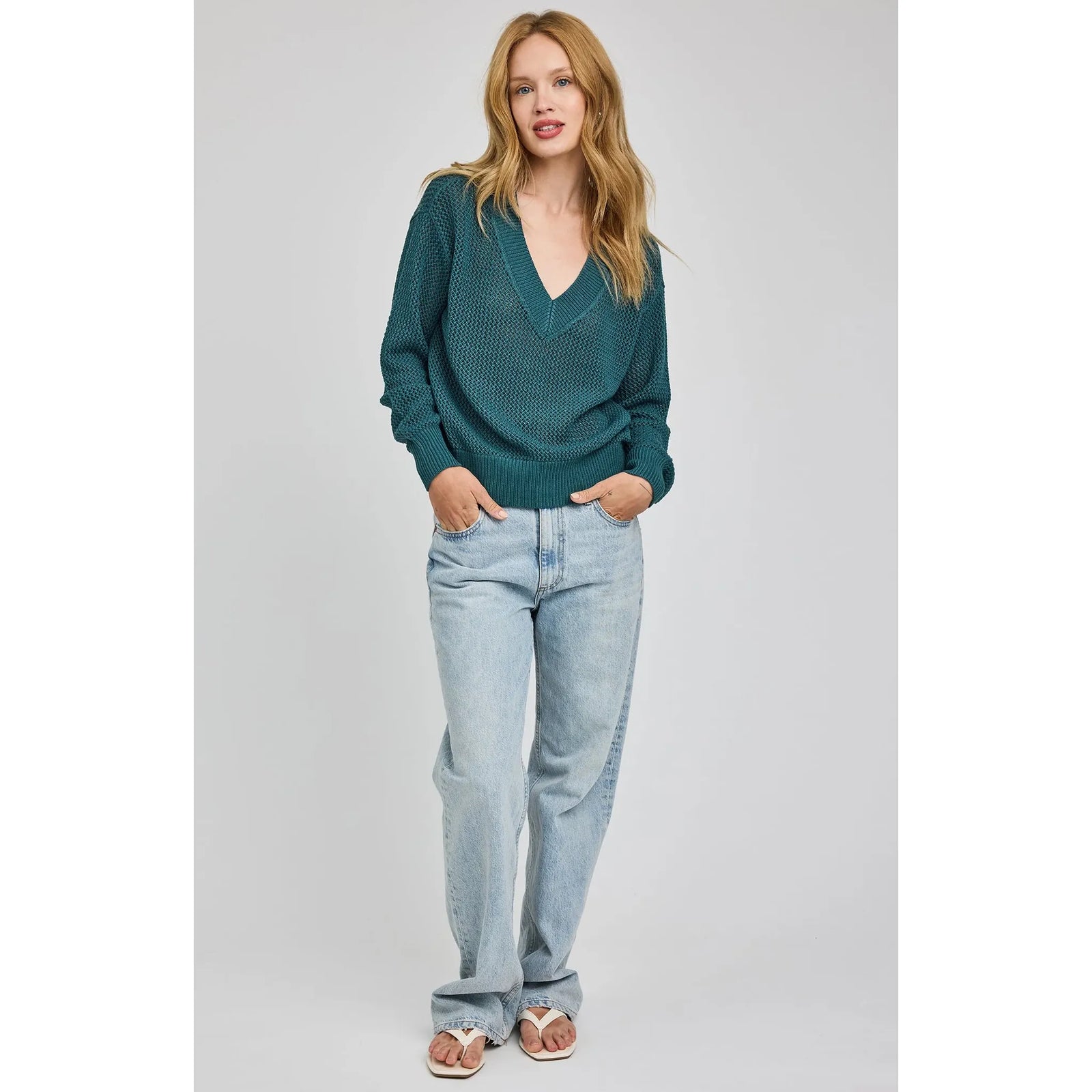 Gentle Fawn Jensen V-Neck Pullover in beige open-knit with relaxed fit, shown with striped shorts.