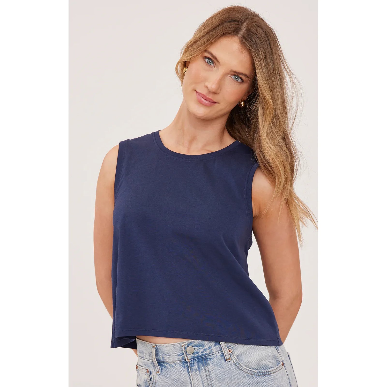 Model wearing navy Gentle Fawn Kate Tank from Icon Series, cotton jersey sleeveless top.