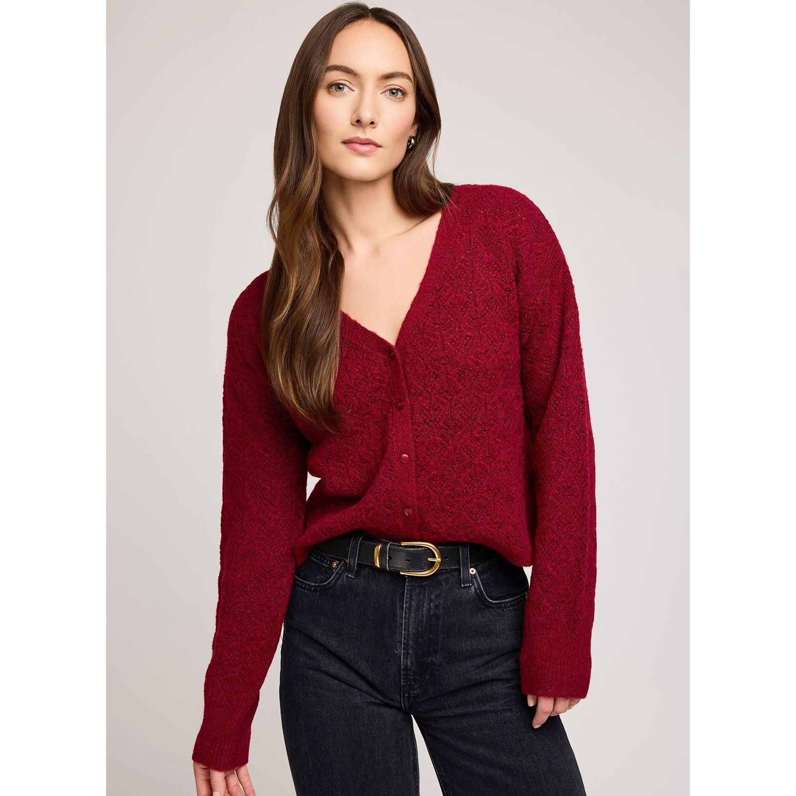 Model wearing burgundy Gentle Fawn Lila Cardigan with V-neck, button front, and textured pointelle knit.