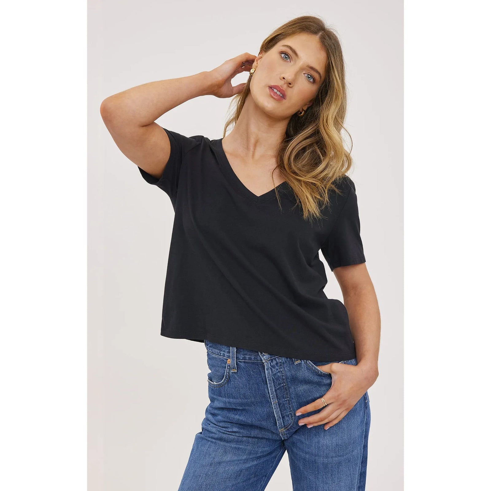 Gentle Fawn Lucy Top: black V-neck short-sleeve cropped cotton top worn with blue jeans.