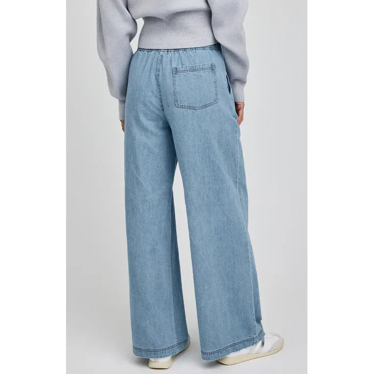 Gentle Fawn Maxwell Pant in light denim with elastic waistband, back patch pocket, and relaxed wide-leg fit.