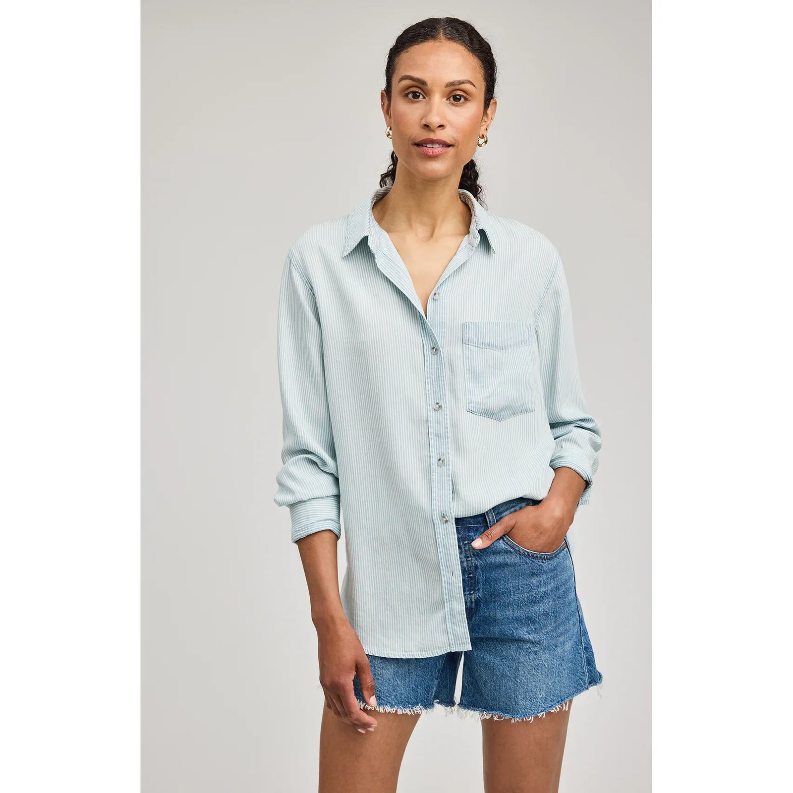 Gentle Fawn Ozzy Button Down Shirt in light blue stripes, 100% Tencel with washed texture, worn with denim shorts.