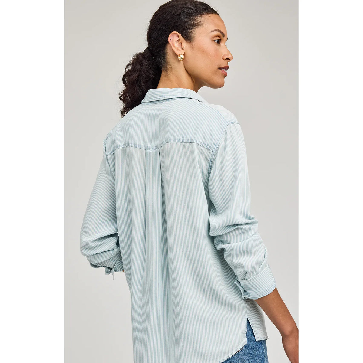 Gentle Fawn Ozzy Button Down Shirt in light blue pinstripes, back view on model with sleeves rolled.