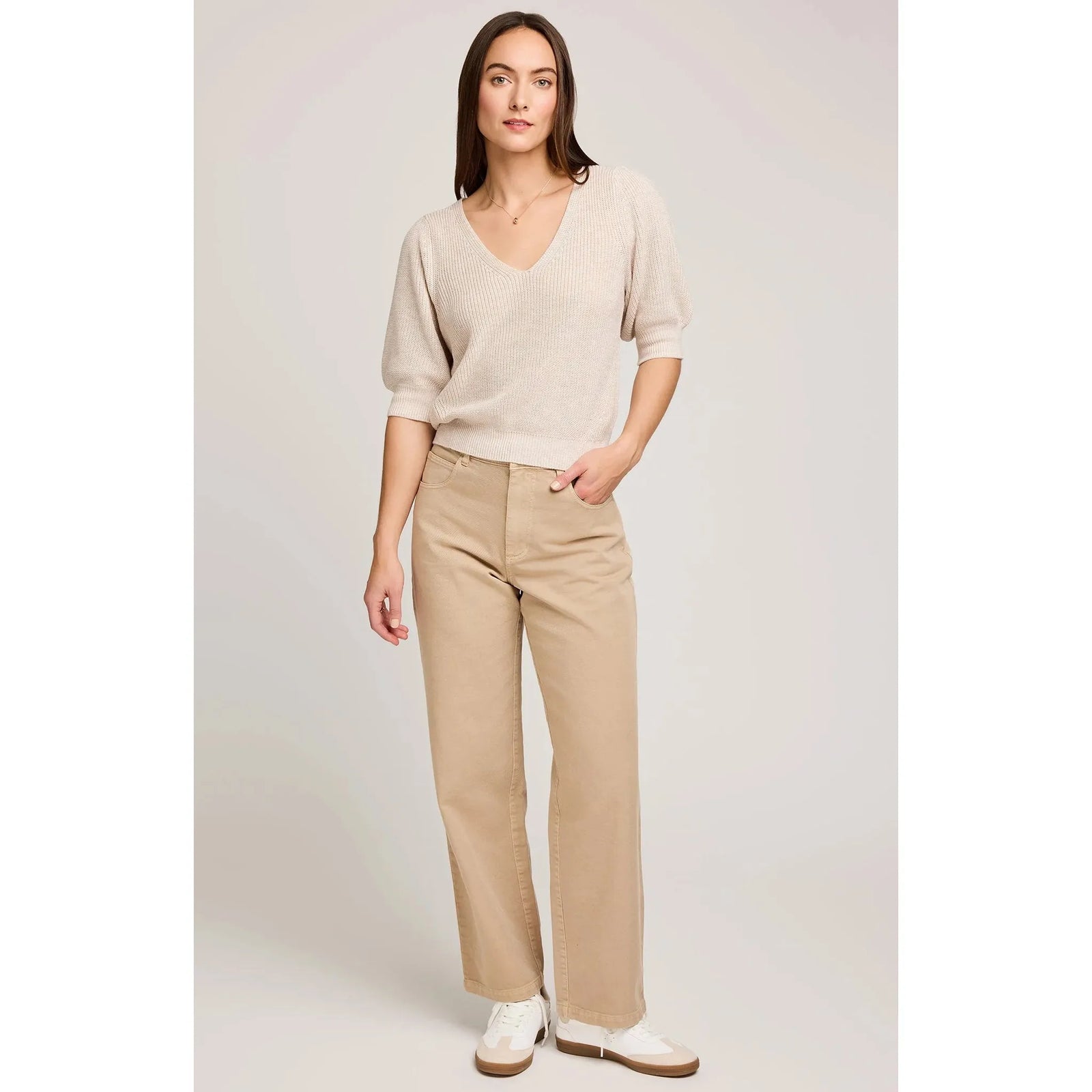 Gentle Fawn Phoebe V-Neck Sweater in heather oatmeal, model wearing cozy knit with puff sleeves.