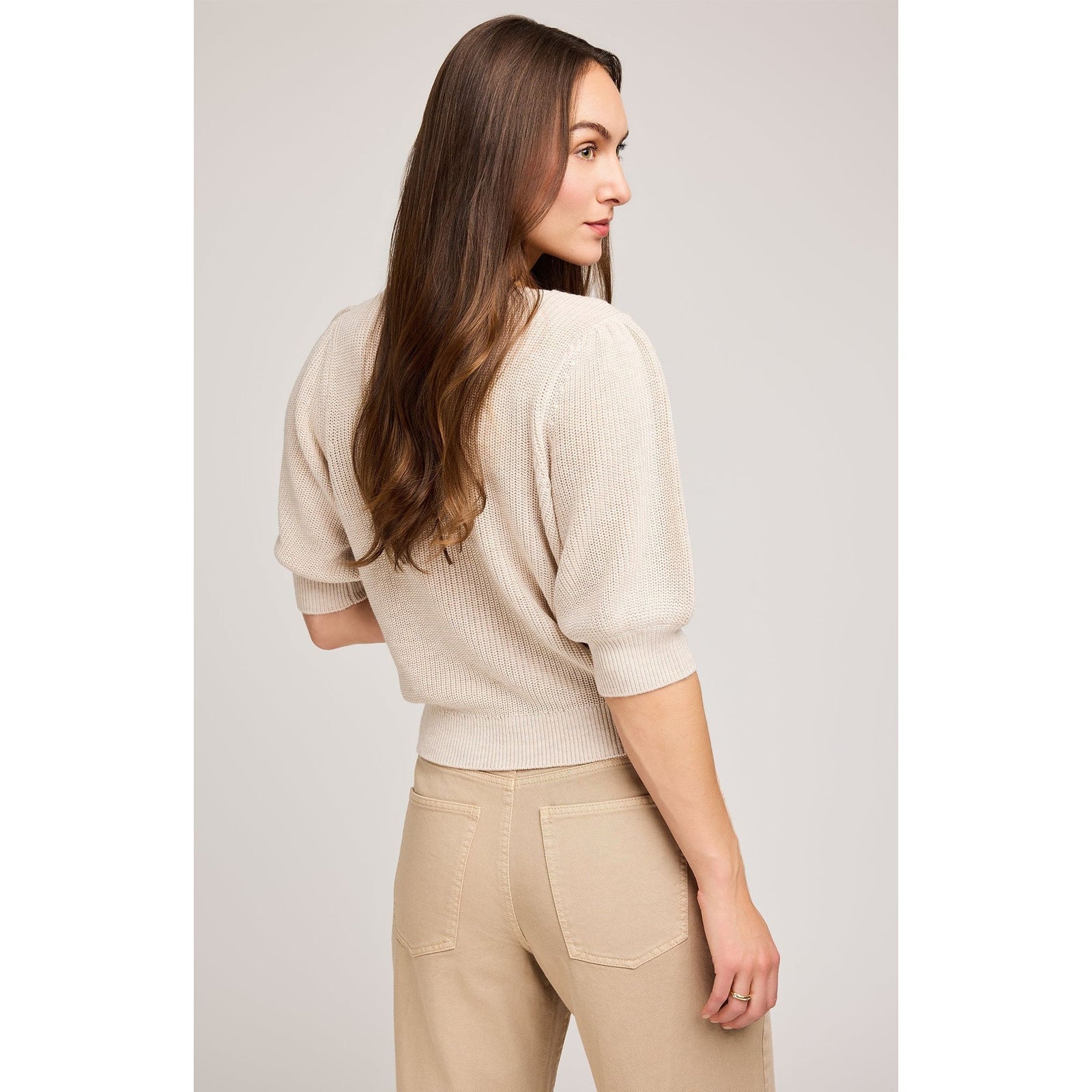 Gentle Fawn Phoebe V-Neck Sweater on model in heather oatmeal, cozy knit with puff sleeves.