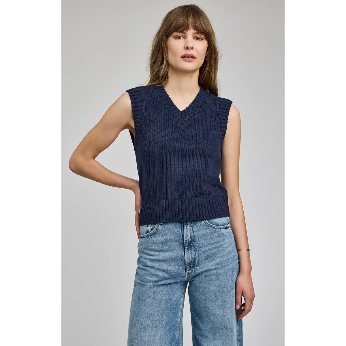 Navy Gentle Fawn Pippa V-Neck Tank on a model; sleeveless knit vest with V-neck and ribbed trim, cropped silhouette.