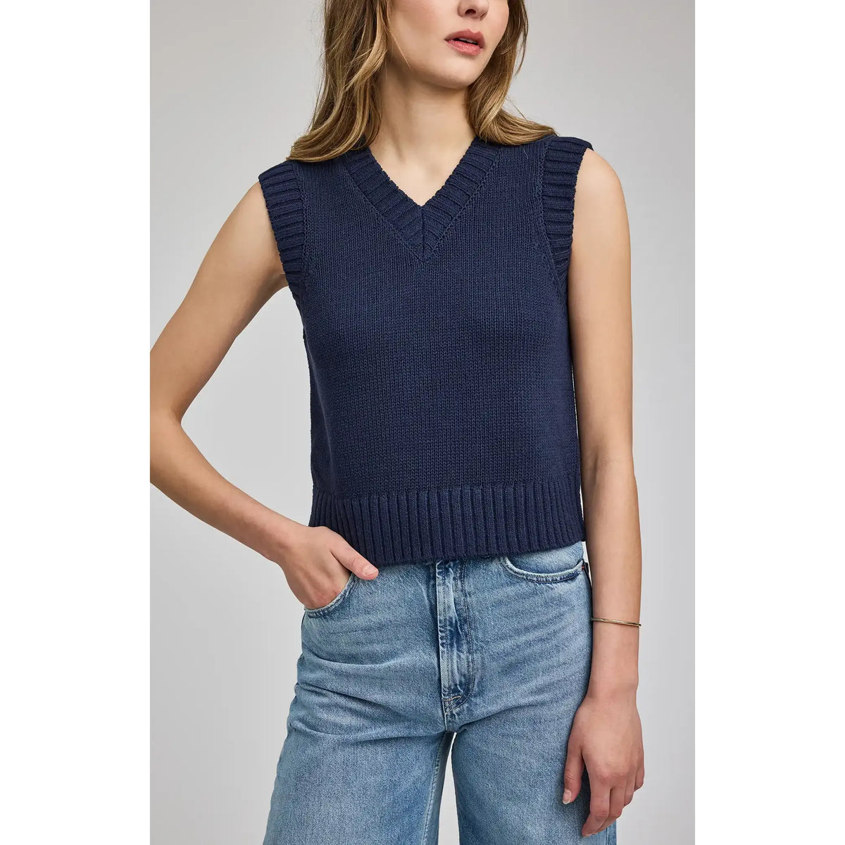 Navy Pippa V-Neck Tank sleeveless knit vest with V-neck and ribbed trim, cropped length on model.