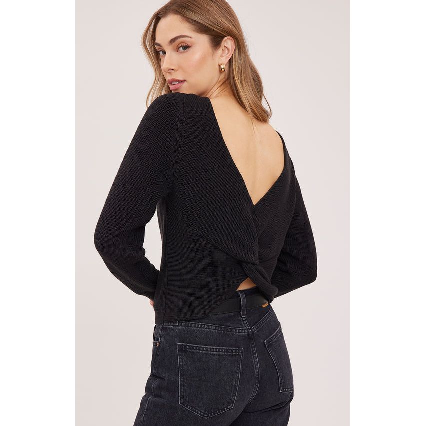 Back view of a black slim-fitting pullover sweater featuring a twisted half-cardigan stitch detail and a wide open neckline.