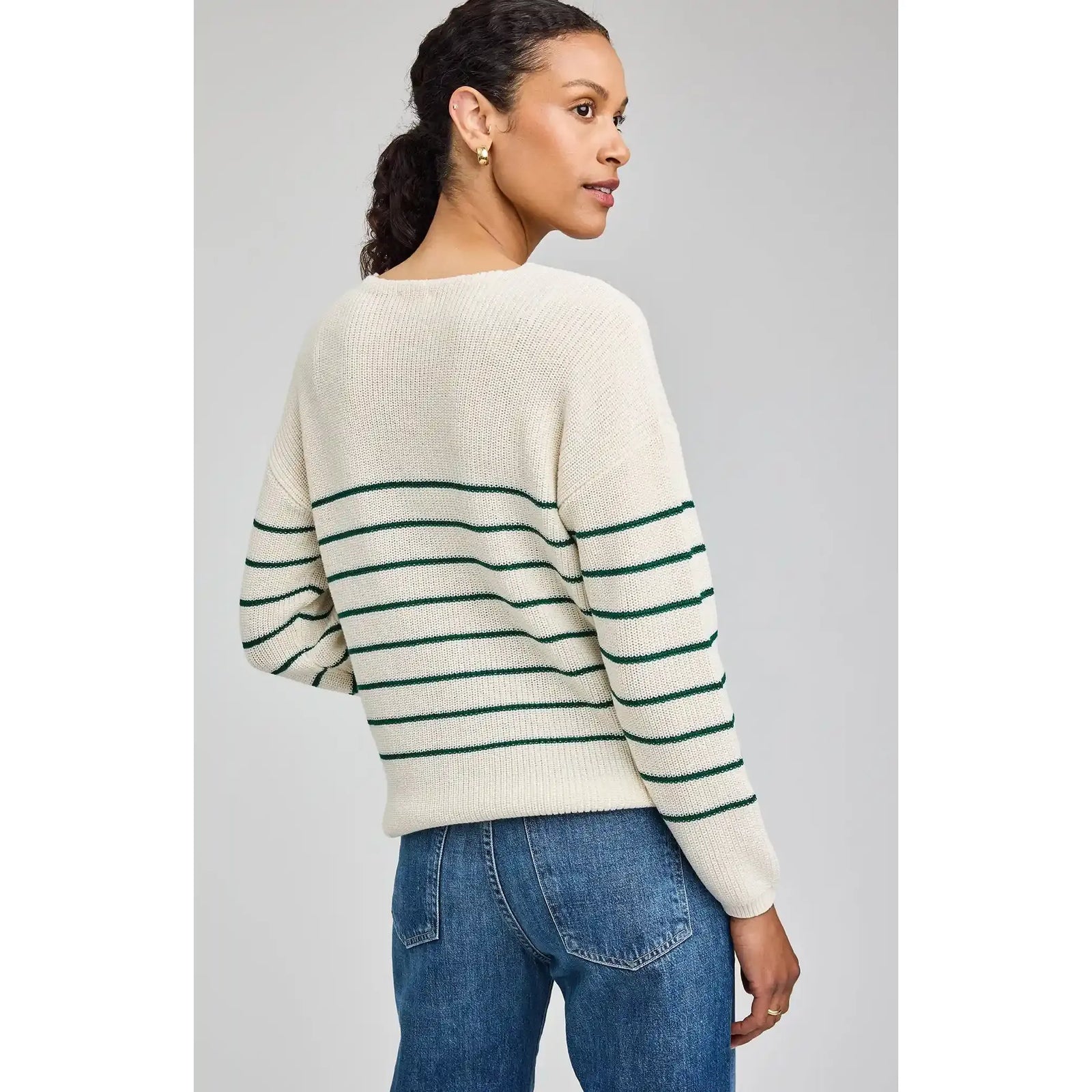Gentle Fawn Tucker Pullover in cream knit with dark green stripes, relaxed fit on model.