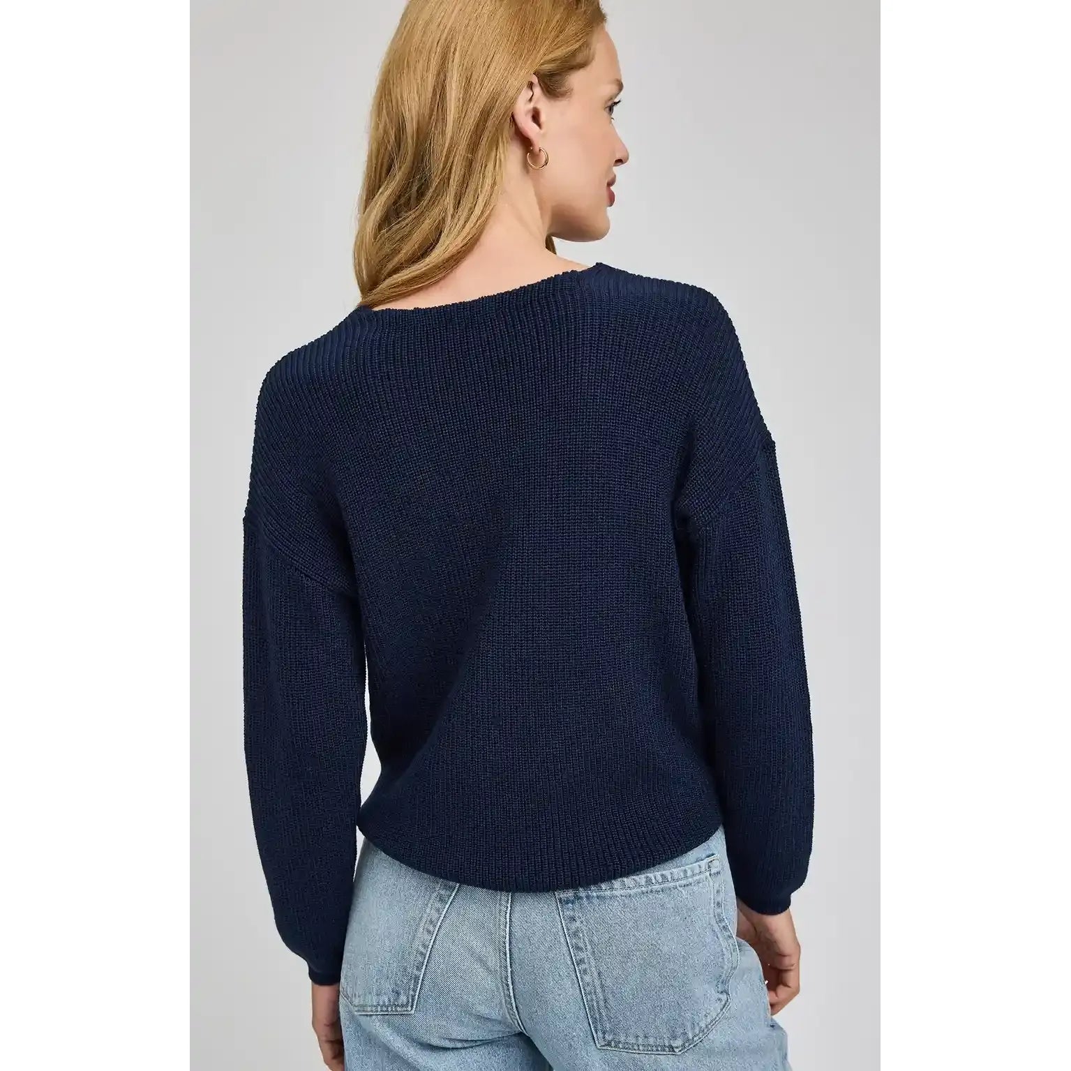 Gentle Fawn Tucker Pullover in navy knit, relaxed fit, back view on model.