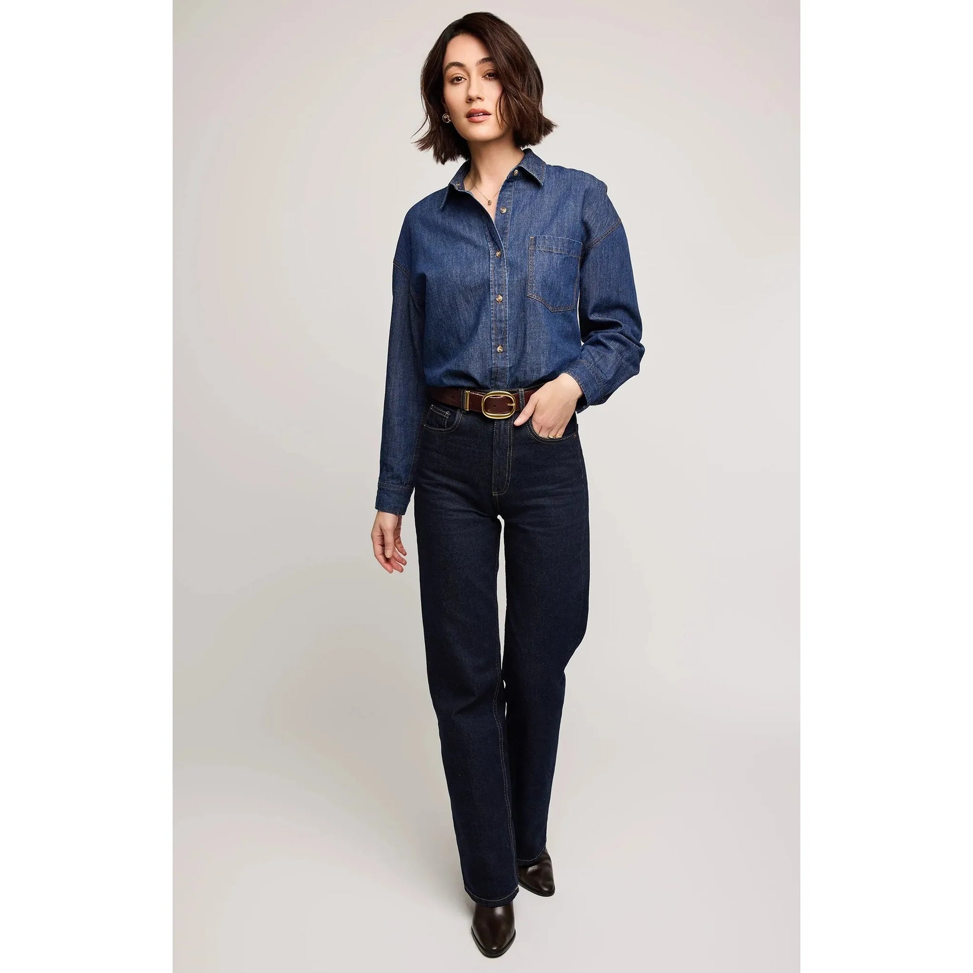 Gentle Fawn Whitney Denim Shirt worn by a model in dark denim with patch pocket and button placket.