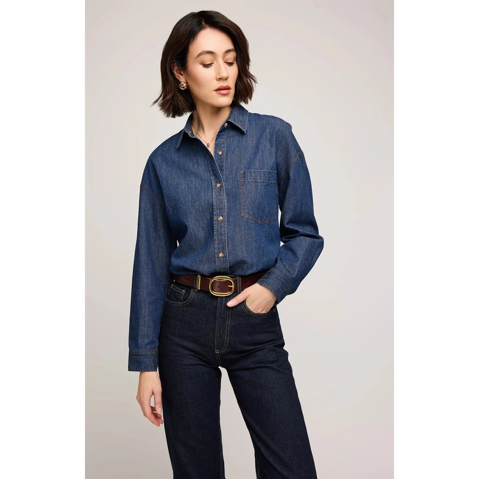 Gentle Fawn Whitney Denim Shirt worn by a model in dark denim with patch pocket and button placket.