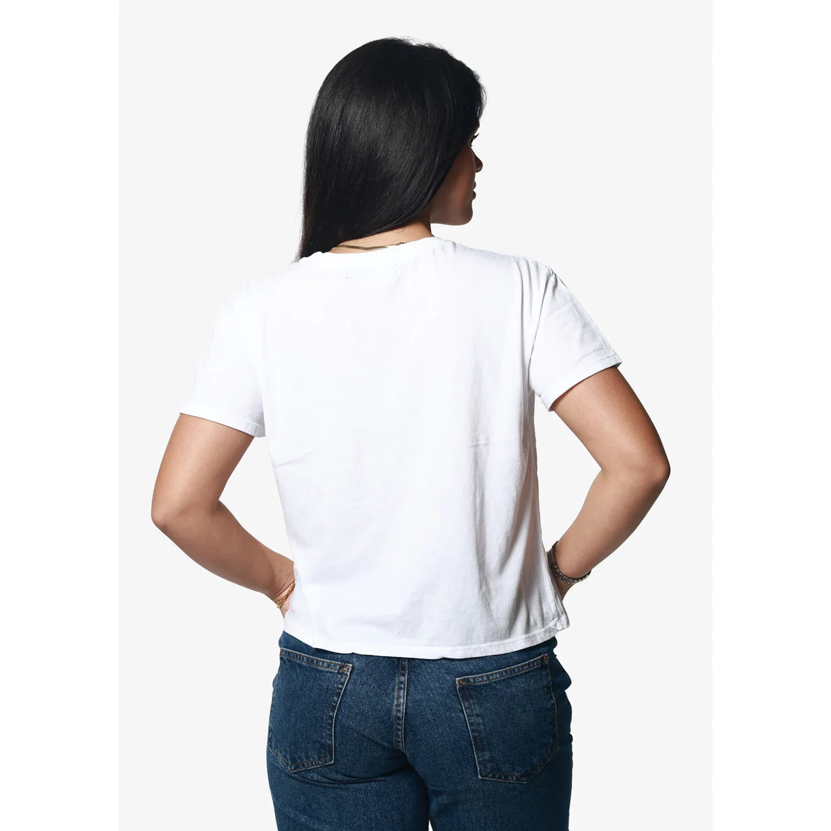 Girl Dangerous Cat's Out of the Bag Classic tee, white relaxed-fit shirt, back view on model.