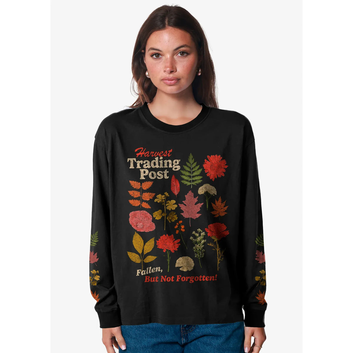 Black women&#39;s Harvest Trading Post boyfriend tee with autumn leaf graphics worn by model.