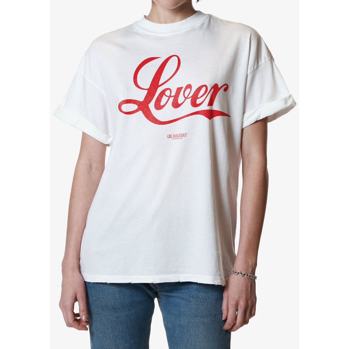 Girl Dangerous Lover Script Tee on a white relaxed-fit shirt with bold red Lover script by Girl Dangerous.