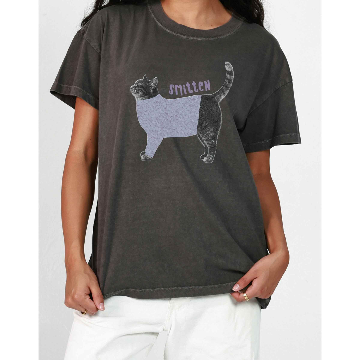 Girl Dangerous S/S Boyfriend Tee featuring a purple-patterned cat graphic and 'smitten' text.