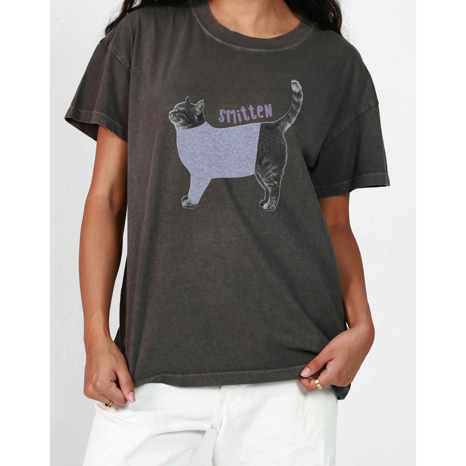 Girl Dangerous S/S Boyfriend Tee featuring a purple-patterned cat graphic and 'smitten' text.